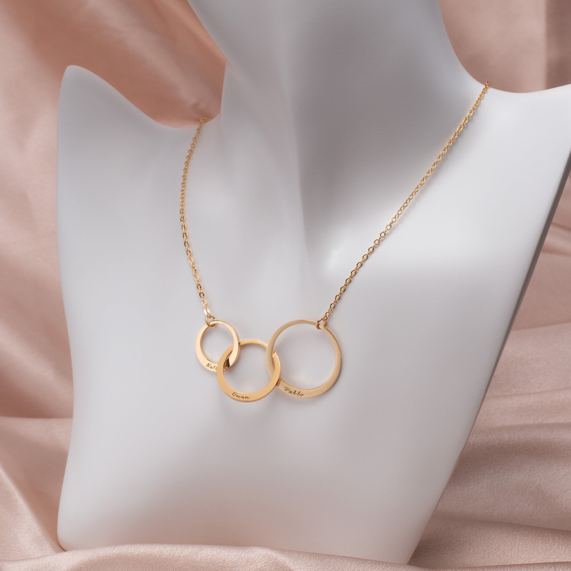 Rose gold personalized circle name necklace with "Olivia" engraving, reflecting light on its polished surface. Perfect gift for her. (Specifies metal color, uses a different name example, and subtly incorporates a benefit/use case.)