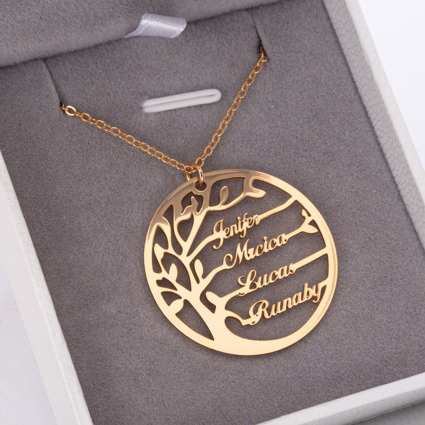 Close-up of a sterling silver Personalized Family Tree Necklace, showcasing the intricately detailed tree pendant and delicate chain. (Focuses on material and detail)